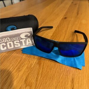 Costa Black Frame Sunglasses with Deep Blue Lenses